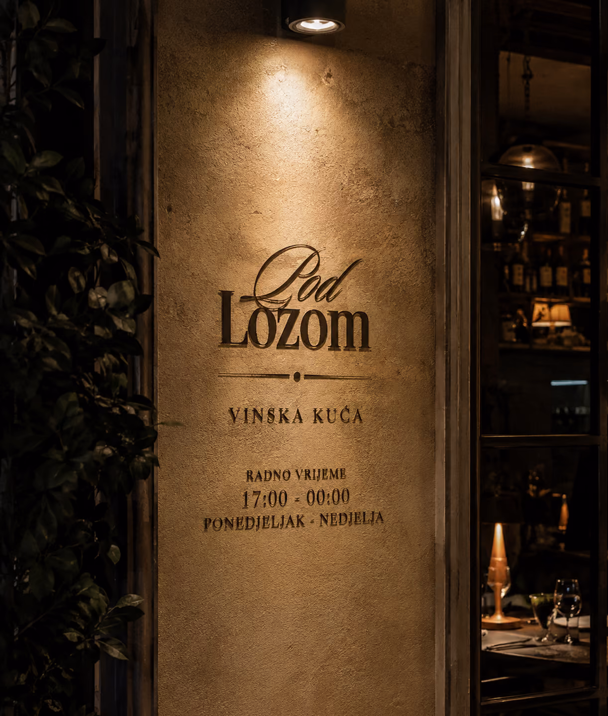 Pod Lozom storefront sign with hours of operation.