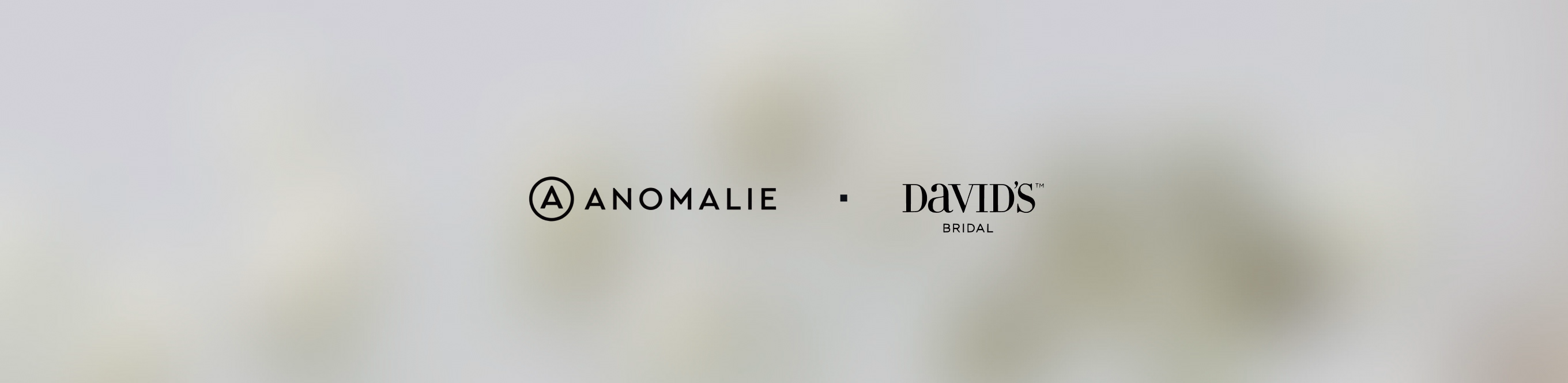 Anomalie and David’s Bridal logos marking the acquisition