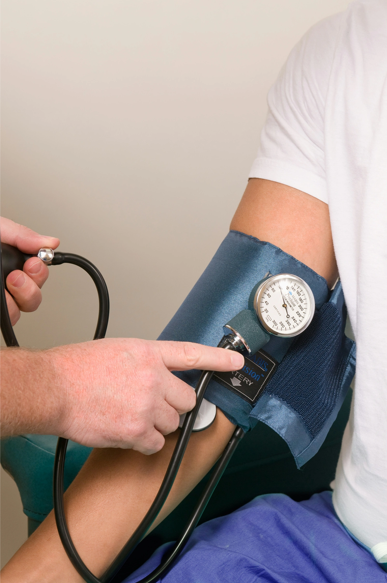 Healthcare professional measuring a patient’s blood pressure.