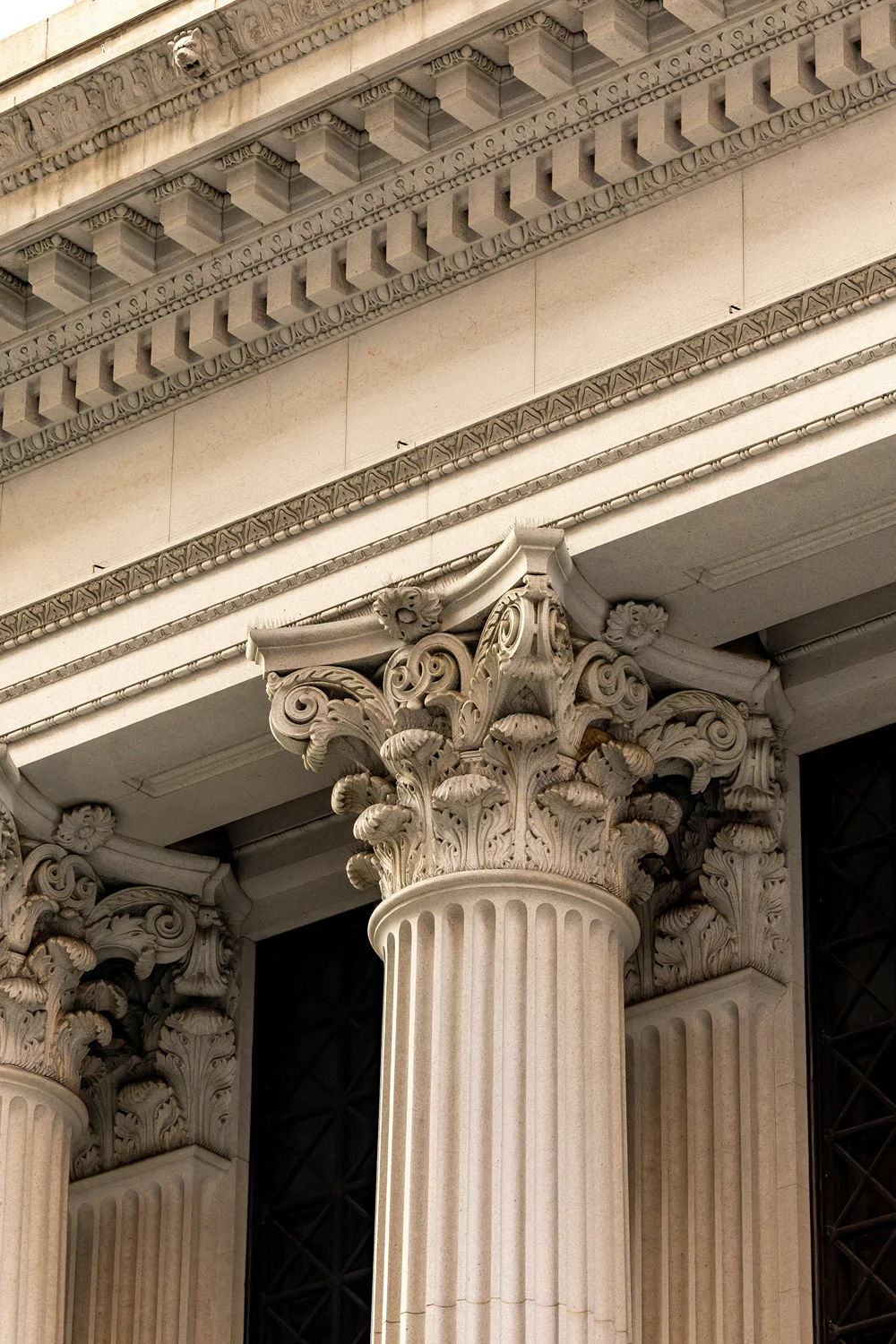 Architectural detail of a classical building with ornate columns.