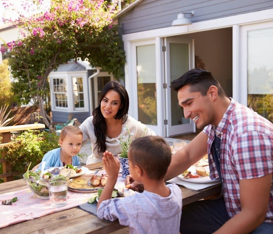 Family sitting together at a picnic table