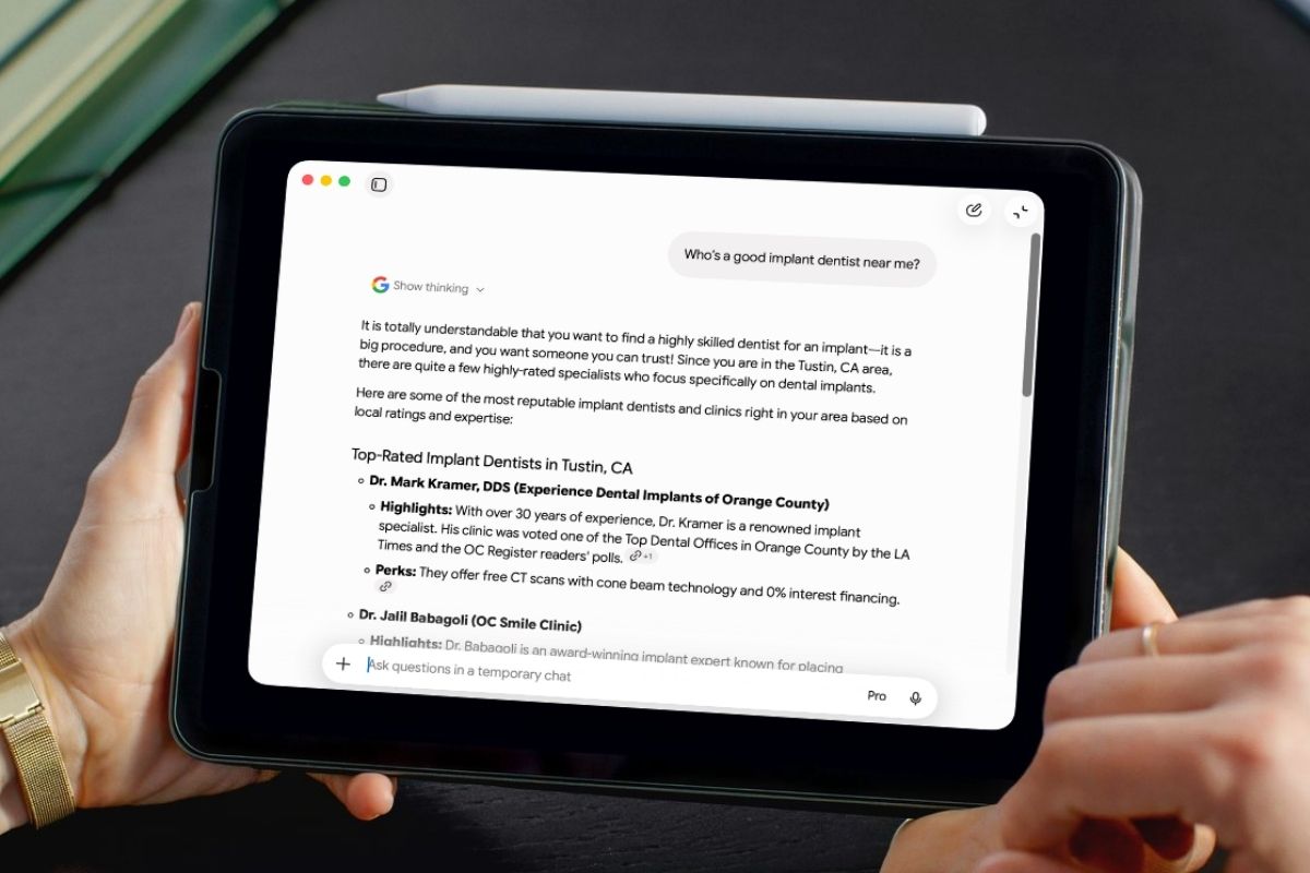 Tablet screen showing a search with Google AI assistant displaying top-rated implant dentists in Tustin, CA, including Dr. Mark Kramer, DDS and Dr. Jalil Babagoli, with highlights and perks about their dental implant services.