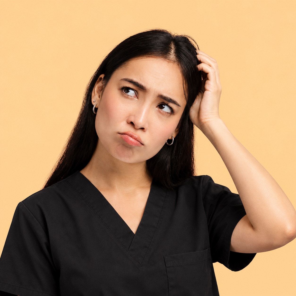 A confused dentist scratching her head