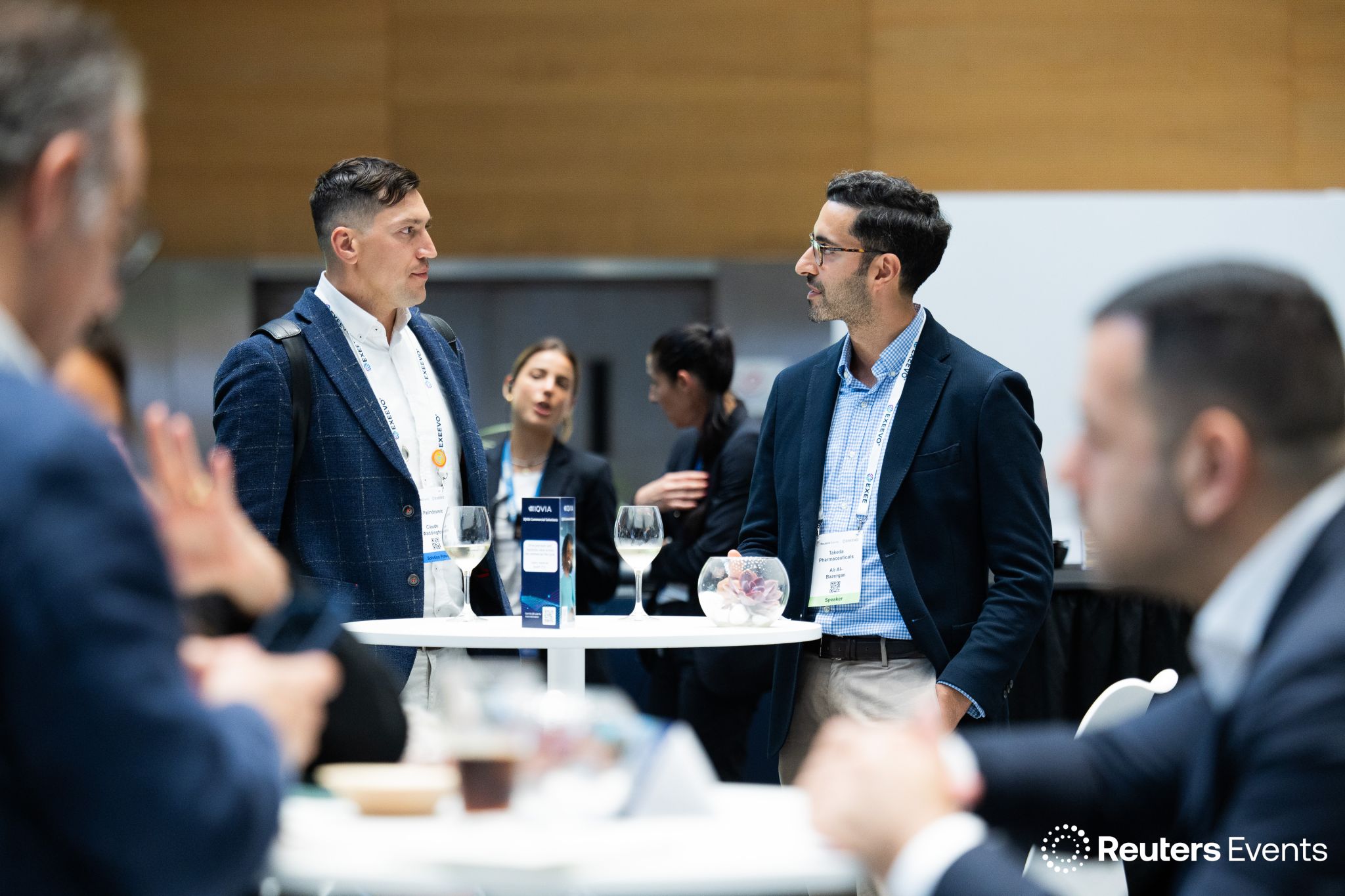 Claude Waddington speaking with a pharmaceutical industry delegate at Reuters Pharma 2026.