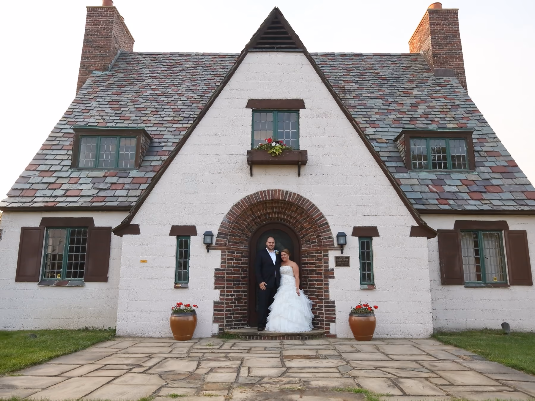 Wedding couple outside their venue by Fullerton Photography