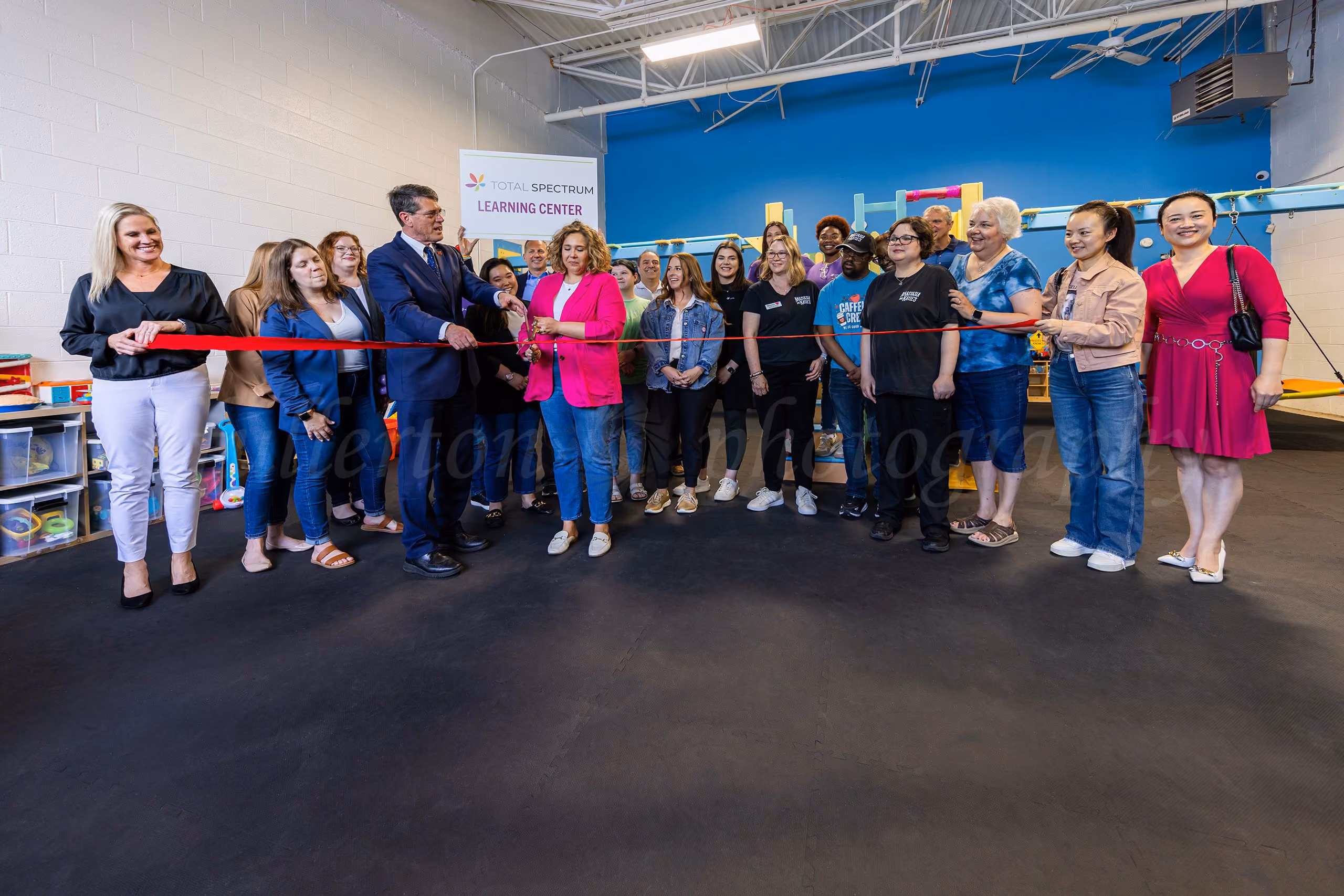 Ribbon cutting ceremony group photo at Total Spectrum Learning Center,  Northville, MI event photography by Fullerton Photography