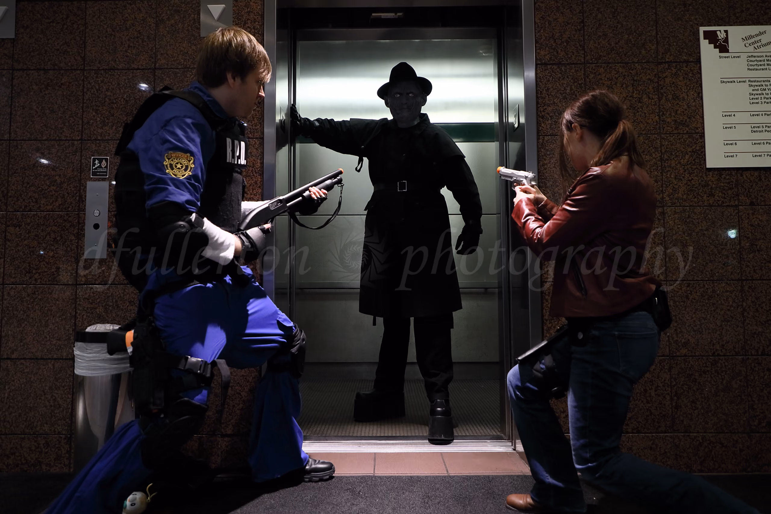 Cosplayers in video game character costumes posing in front of an elevator at a convention