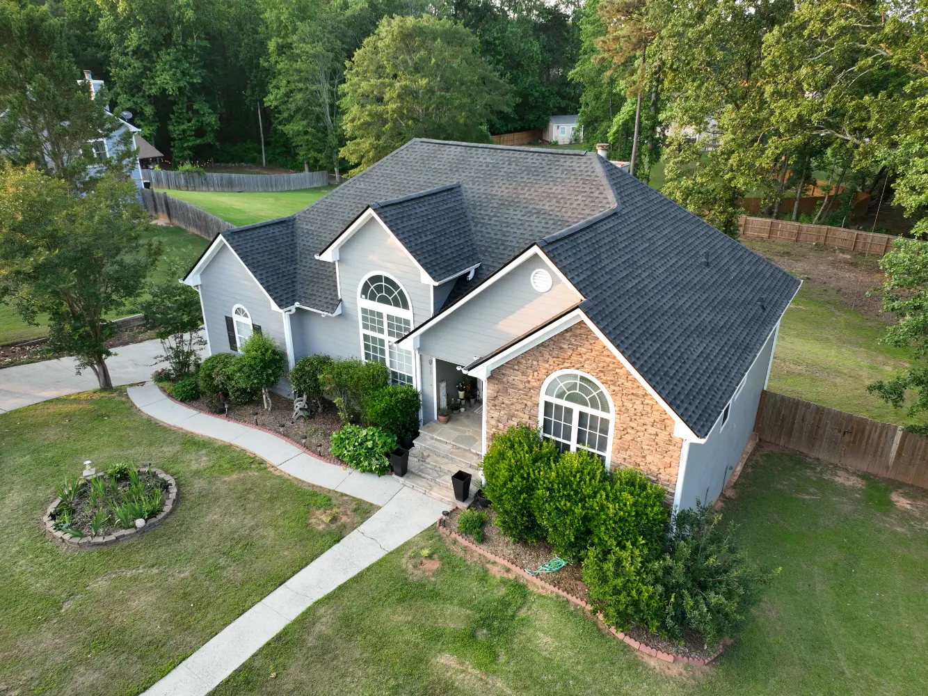 A completed residential roof replacement in Buford, Georgia, by Douglas Construction, a trusted residential roofing contractor. The home features a durable, high-quality roof with expertly installed shingles.