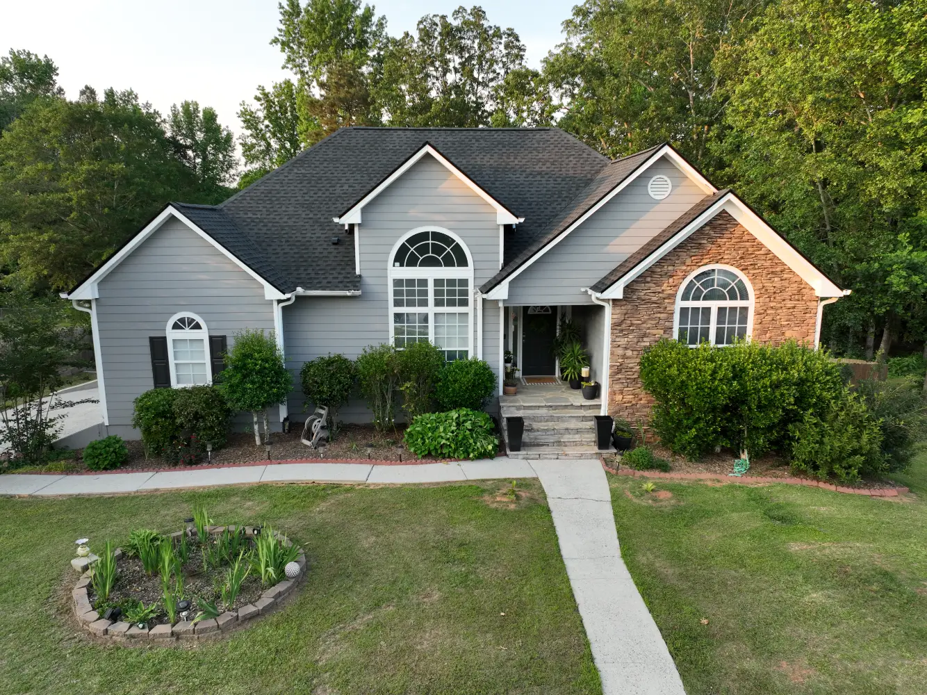 A completed residential roof replacement in Buford, Georgia, by Douglas Construction, a trusted residential roofing contractor. The home features a durable, high-quality roof with expertly installed shingles.