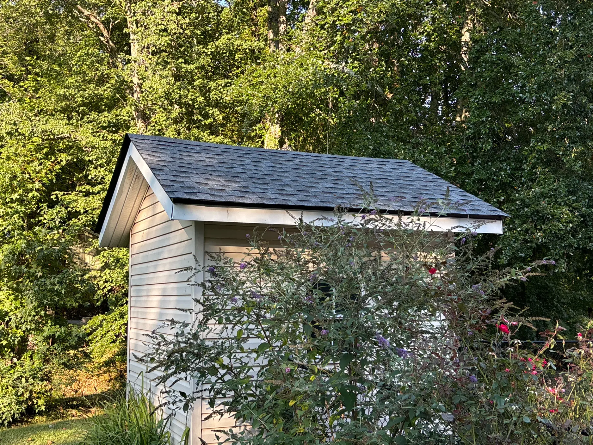 A newly completed shed roof replacement in Gainesville, Georgia, by Douglas Construction, a trusted residential roofing contractor. The home features a durable, high-quality roof with expertly installed shingles.