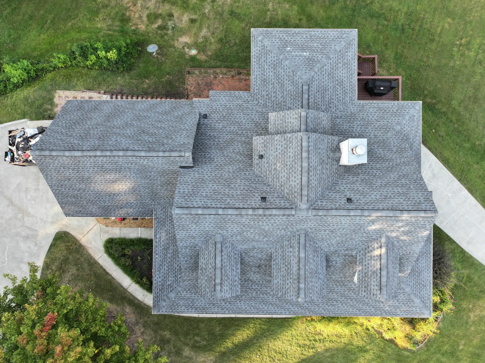 A newly completed residential roof replacement in Gainesville, Georgia, by Douglas Construction, a trusted residential roofing contractor. The home features a durable, high-quality roof with expertly installed shingles.