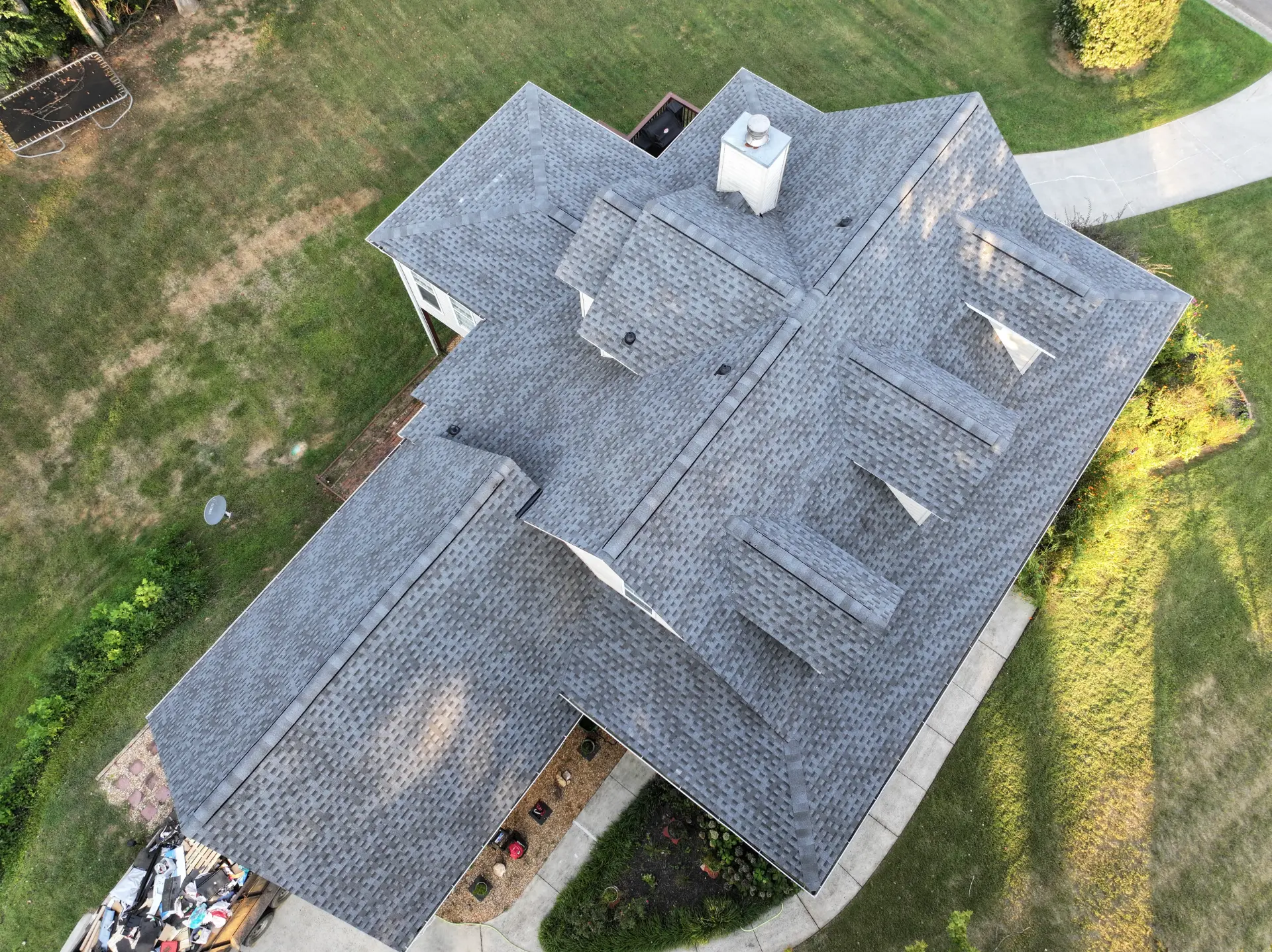 A newly completed residential roof replacement in Gainesville, Georgia, by Douglas Construction, a trusted residential roofing contractor. The home features a durable, high-quality roof with expertly installed shingles.