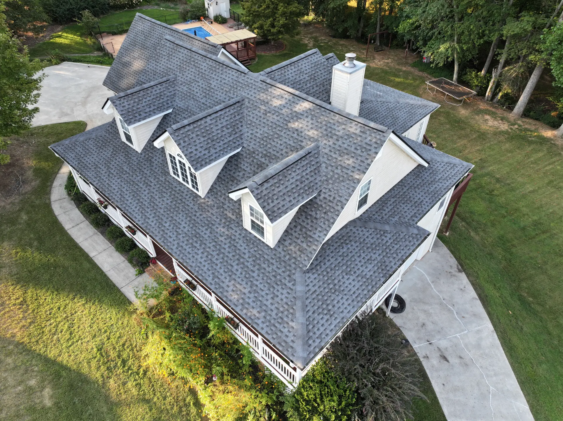 A newly completed residential roof replacement in Gainesville, Georgia, by Douglas Construction, a trusted residential roofing contractor. The home features a durable, high-quality roof with expertly installed shingles.