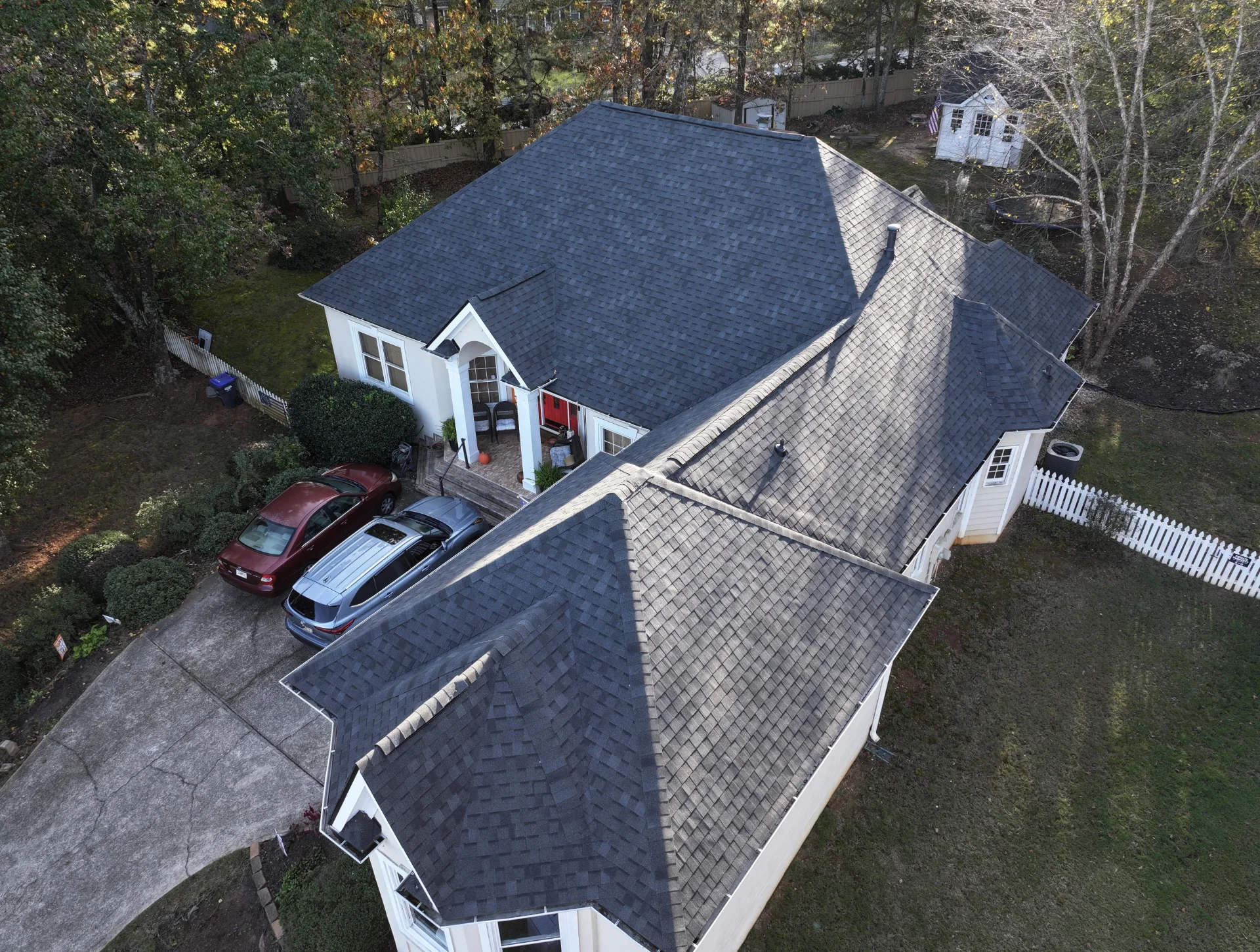 A newly completed residential roof replacement in Lawrenceville, Georgia, by Douglas Construction, a trusted residential roofing contractor. The home features a durable, high-quality roof with expertly installed shingles.