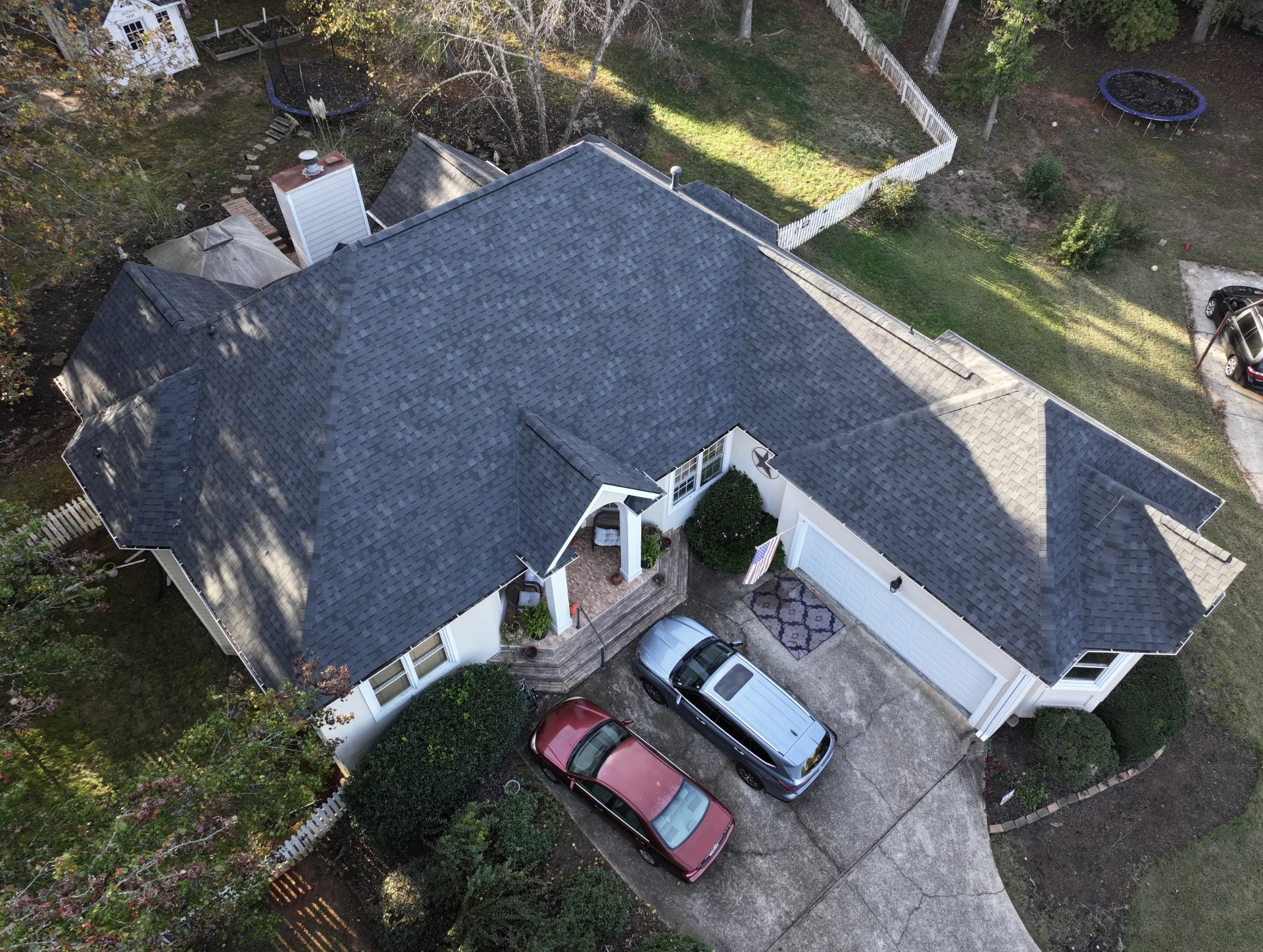 A newly completed residential roof replacement in Lawrenceville, Georgia, by Douglas Construction, a trusted residential roofing contractor. The home features a durable, high-quality roof with expertly installed shingles.