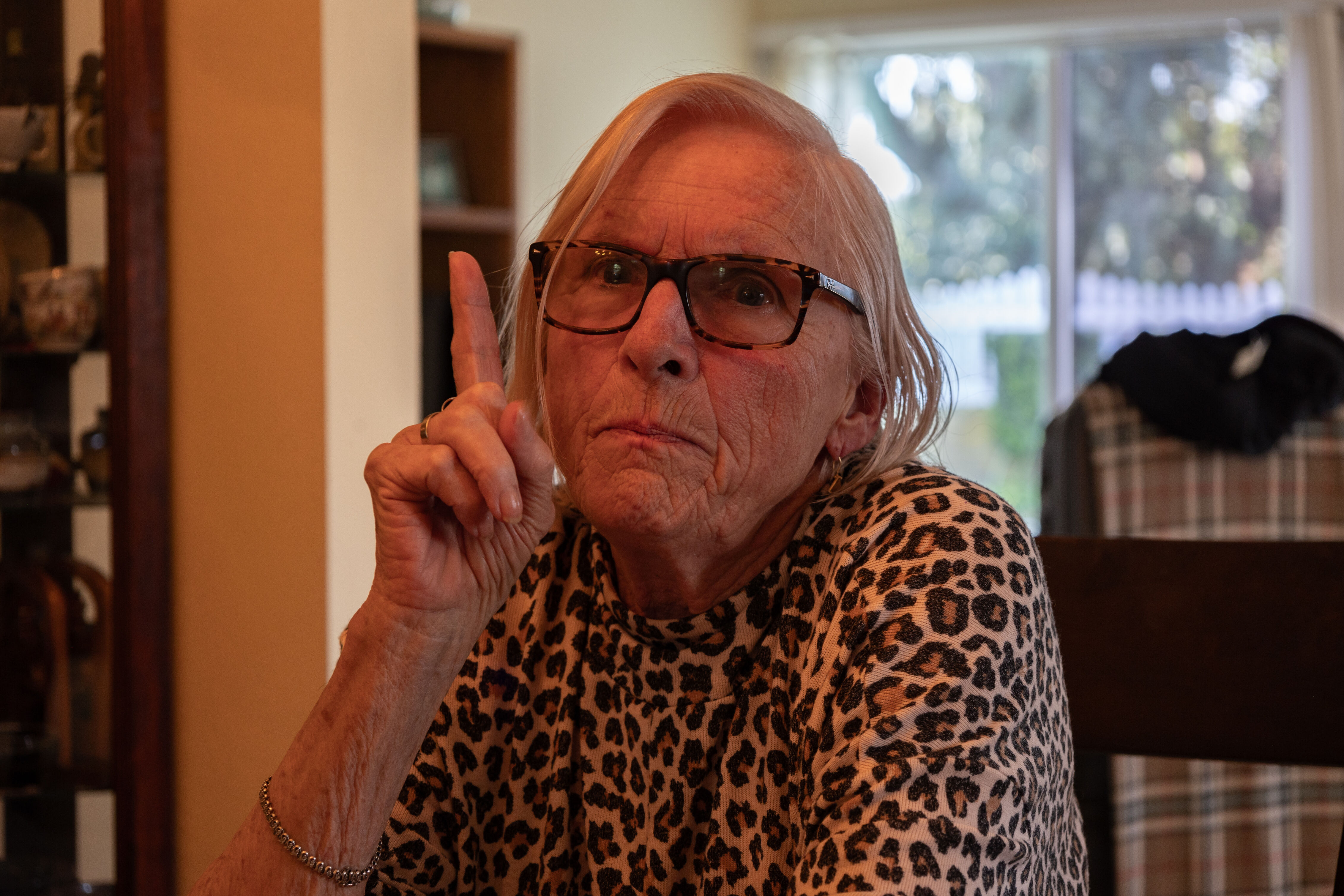A photo of an elderly women holding a stern expression