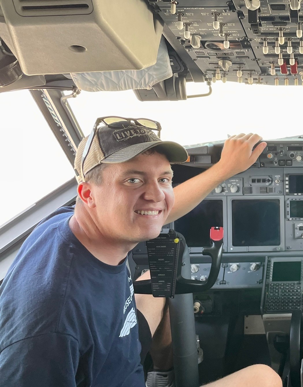 Matthew Kock, flight instructor, seated in an aircraft cockpit.