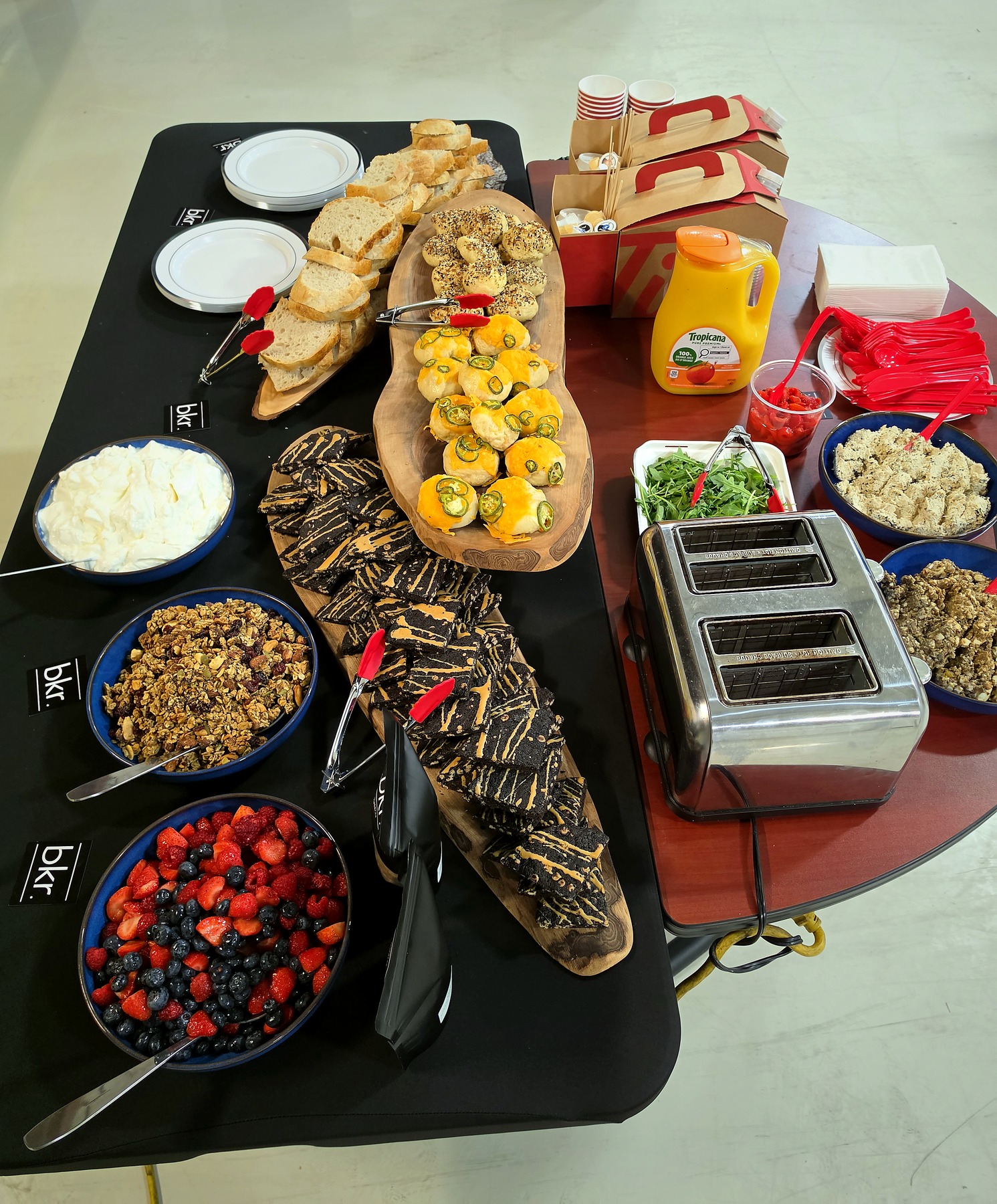 SBREAD catering spread with fresh bread, spreads, granola and fruit