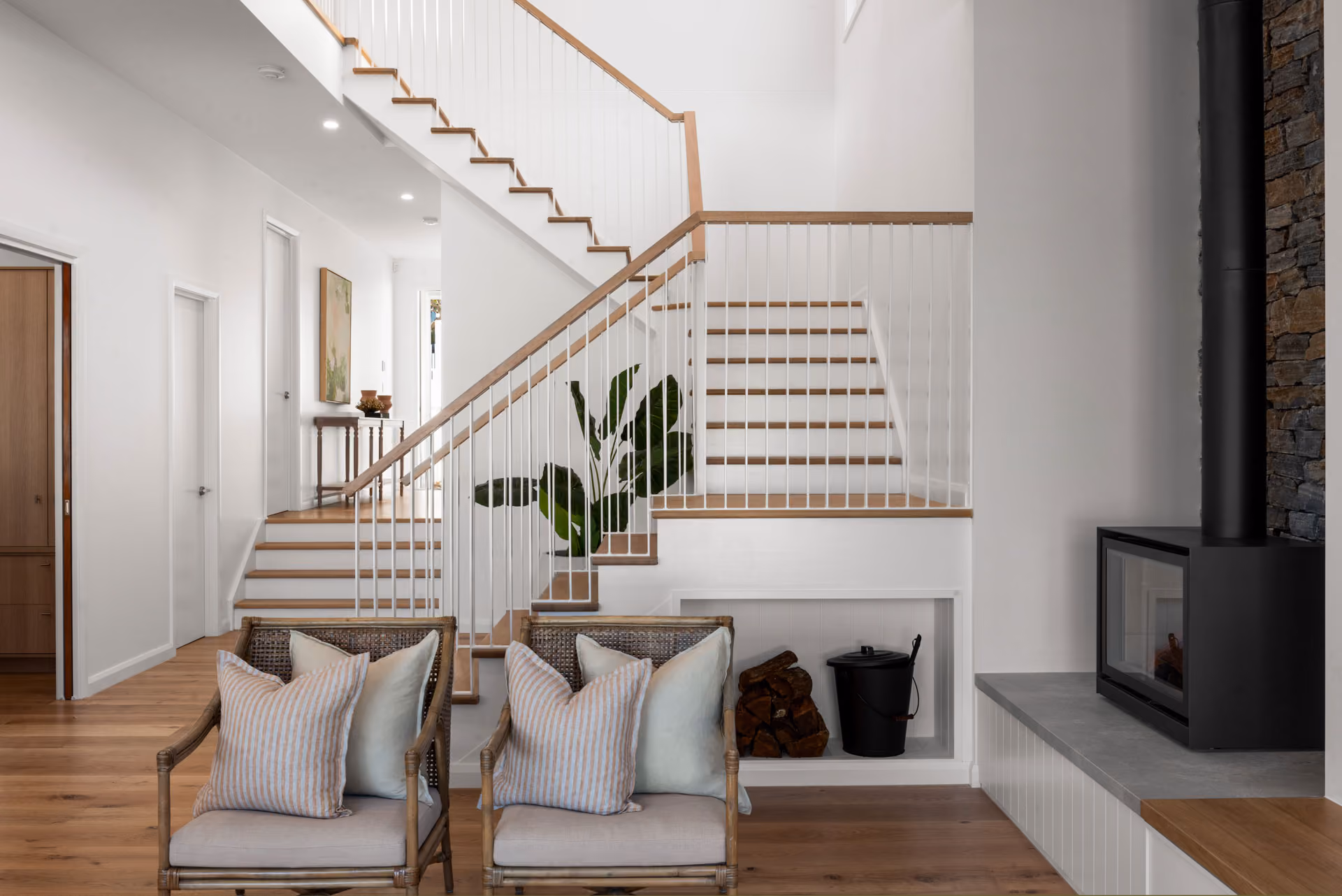 Stair hall and fireplace in a completed Kingdom Constructions home