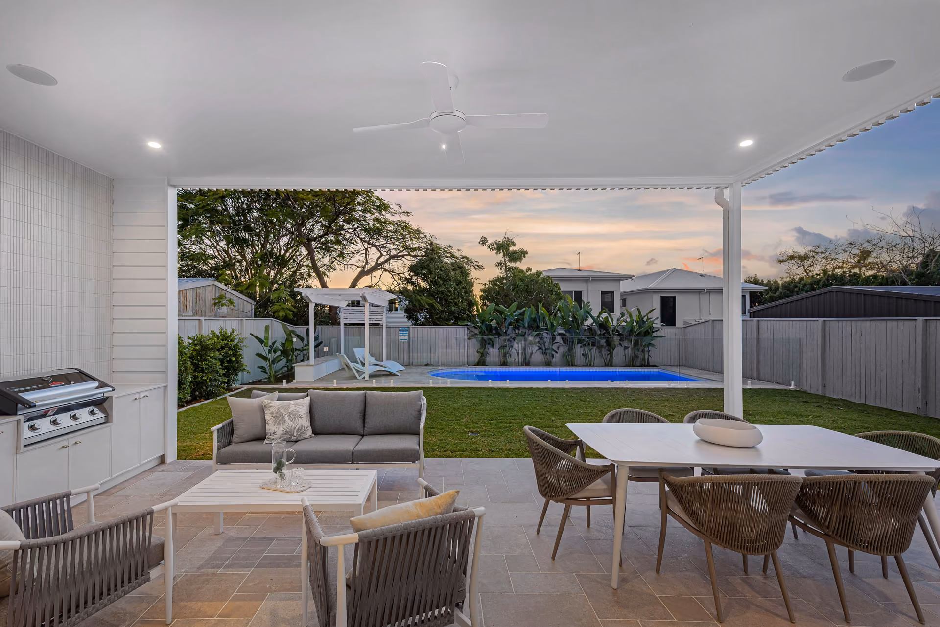 Covered outdoor living beside the pool
