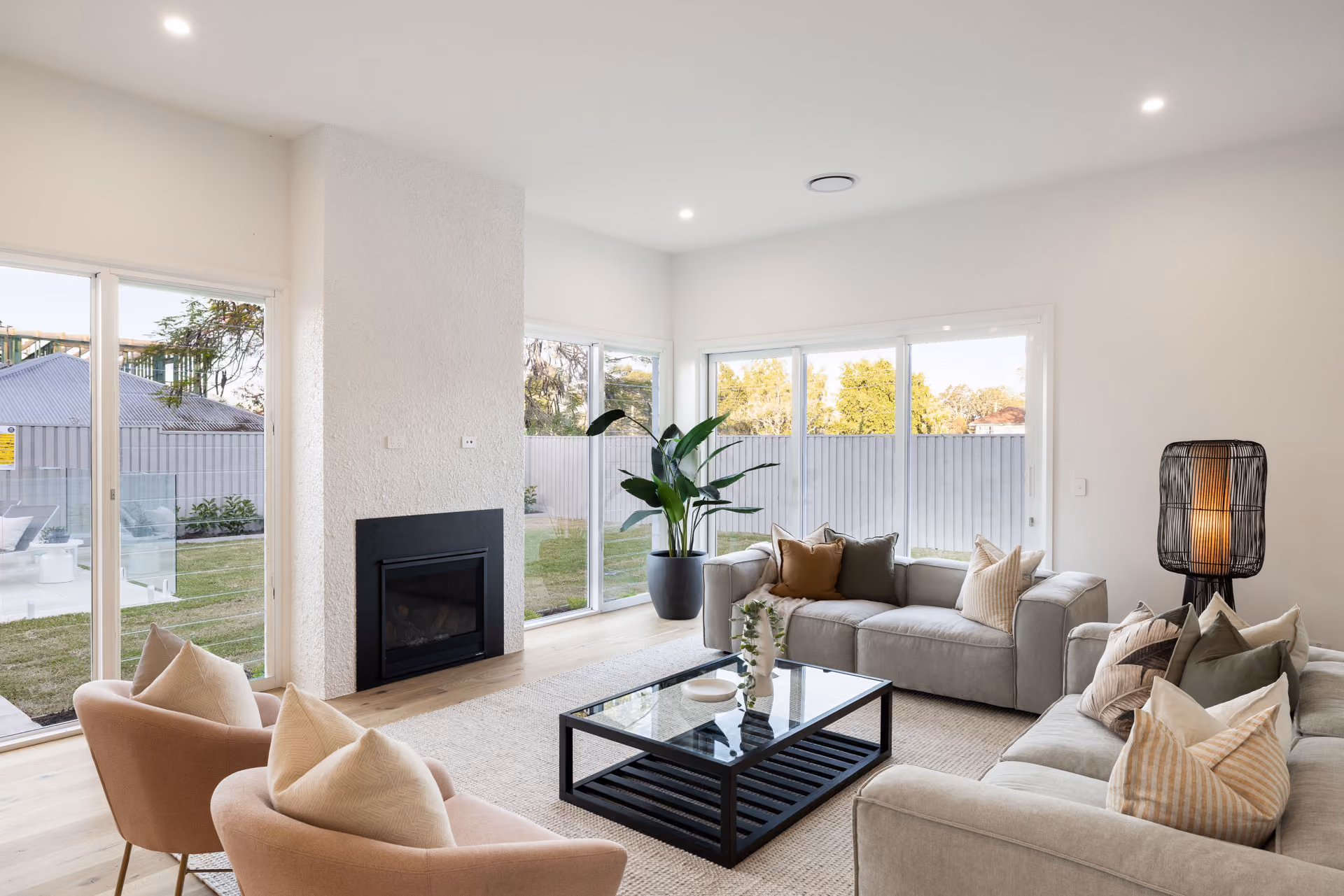 Living room and fireplace in a completed custom home
