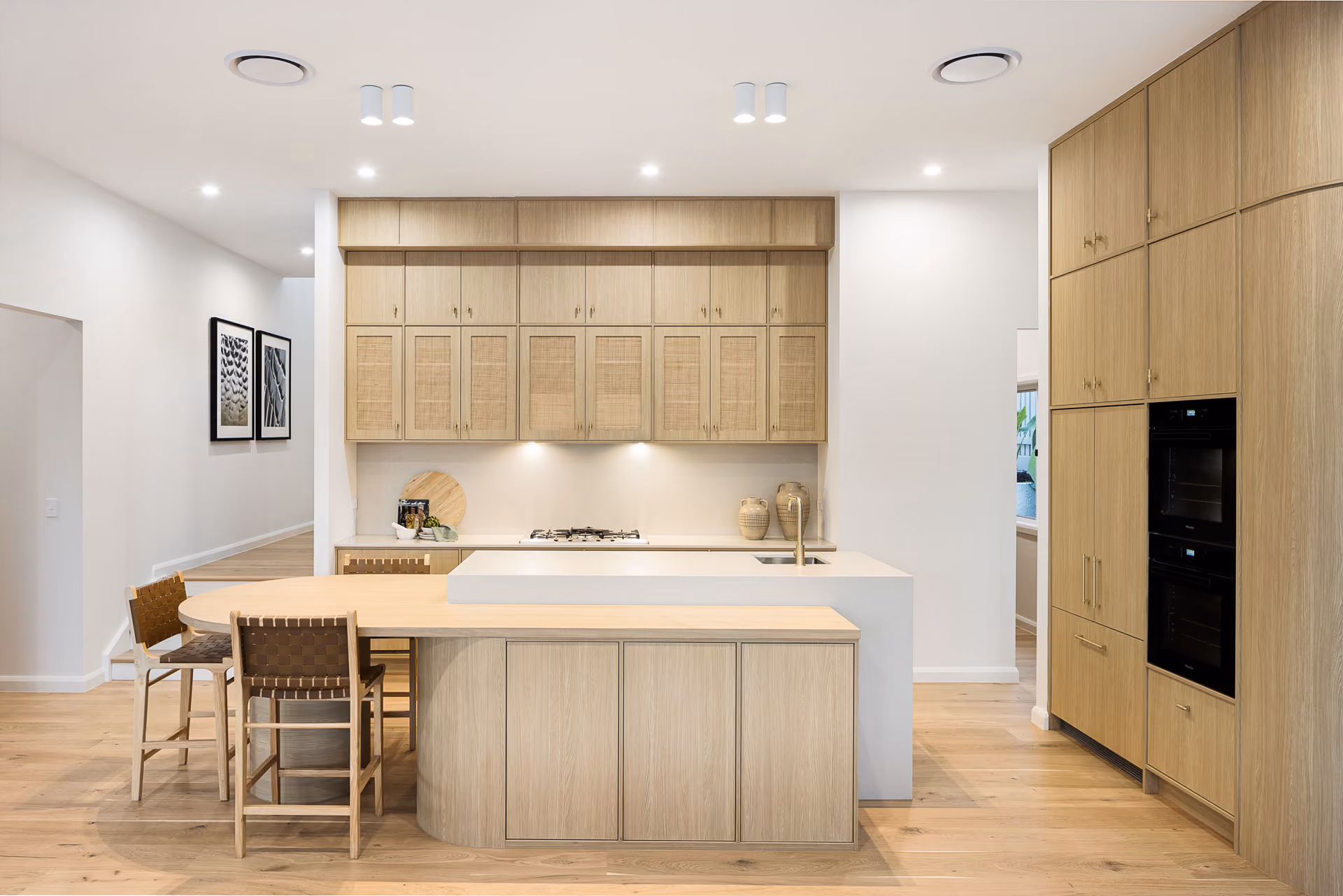 Kitchen and living in a completed home built from this floor plan