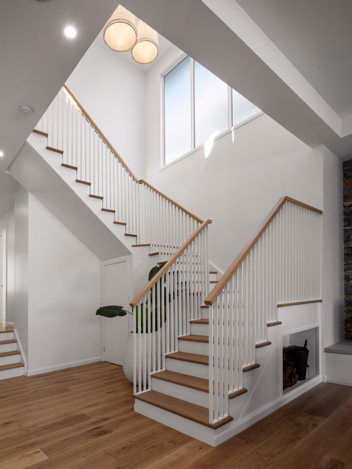 Stair hall in a completed knock-down rebuild