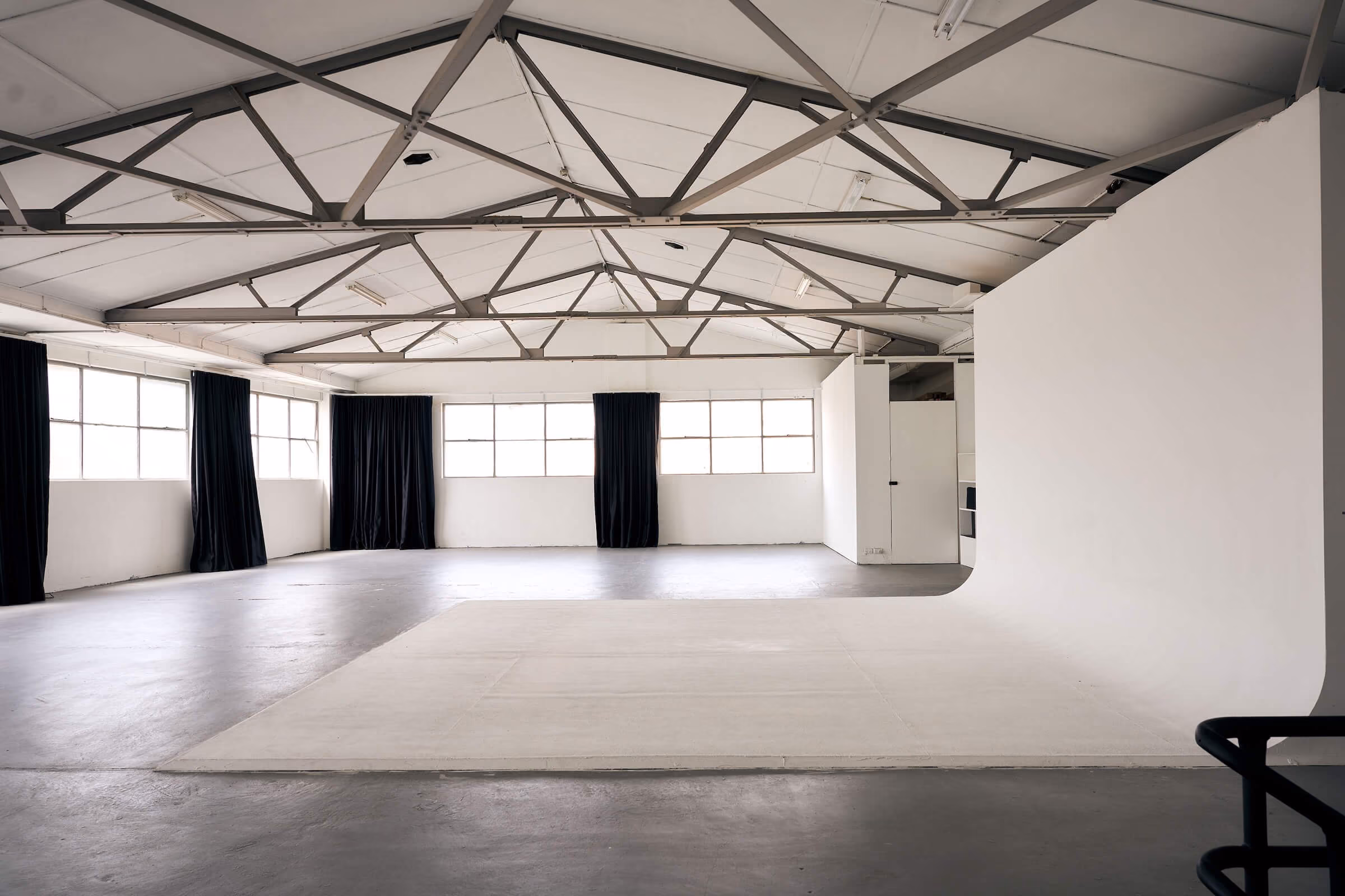Looking across the cyclorama in Frank the studio with natural light flooding the space