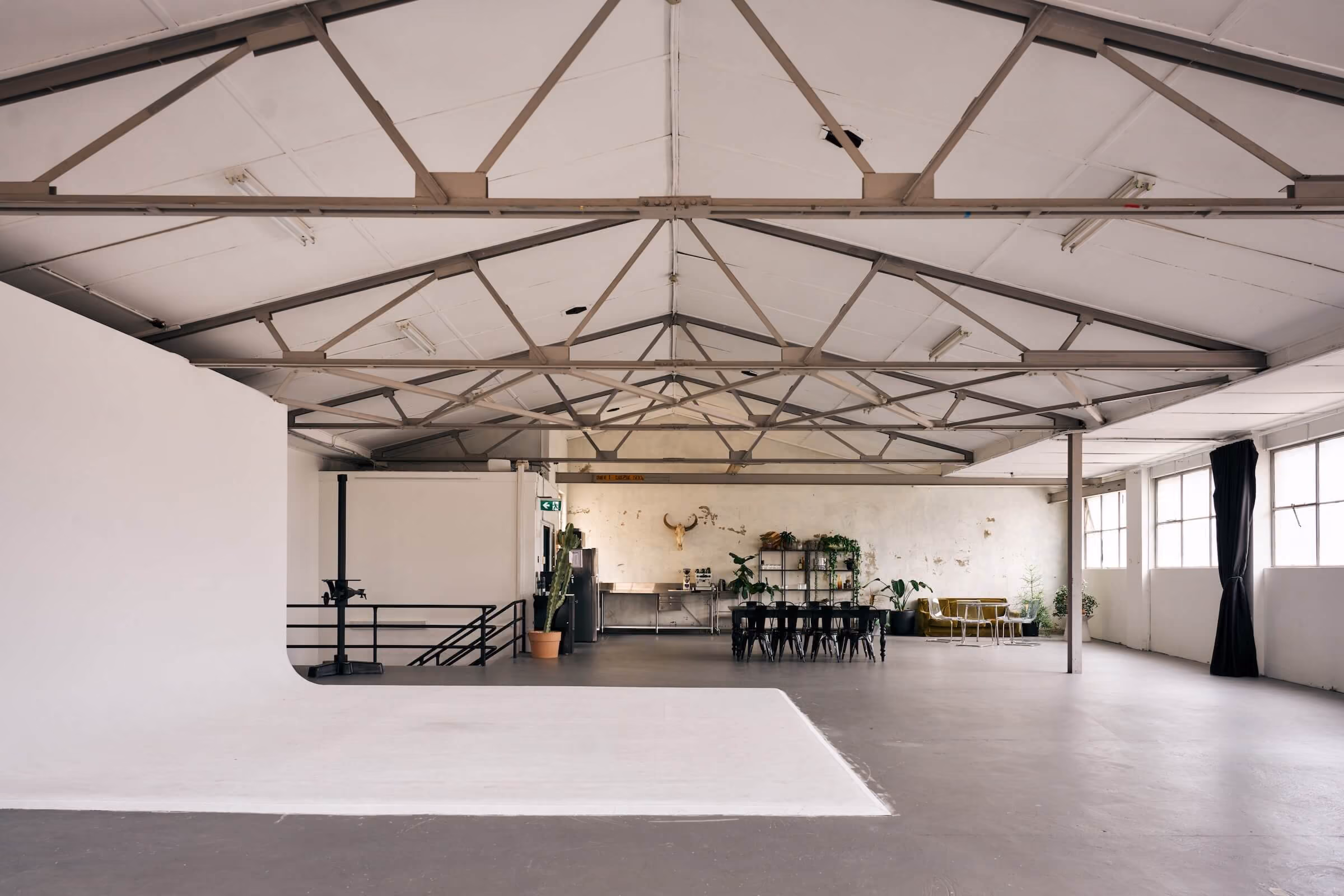 The view across the cyclorama towards the kitchen and dining table of Frank the Studio