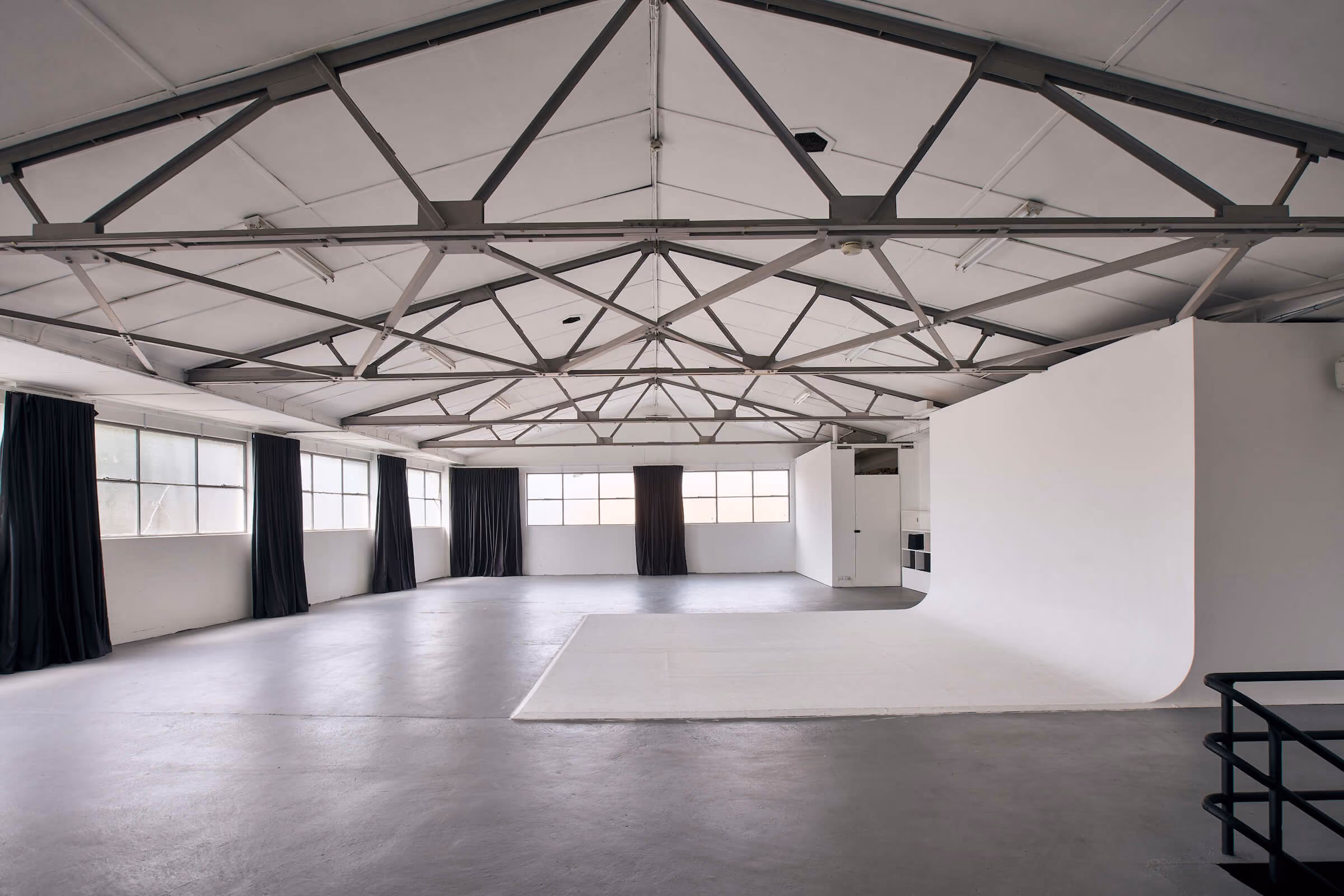 Looking across the expanse of Frank the studio, with natural light flooding the wide open space and lighting up the cyclorama
