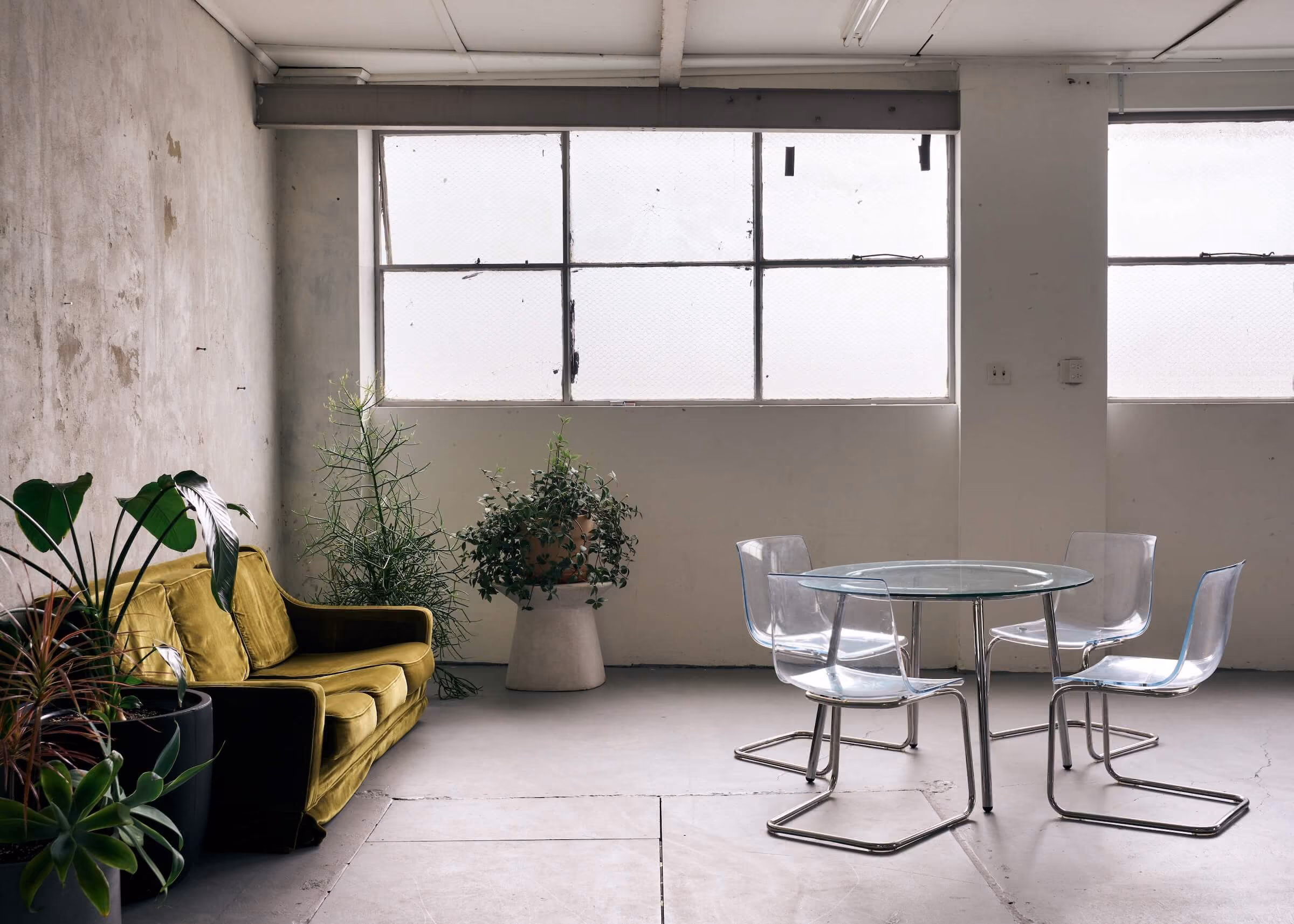 A lounge and sitting area in Frank the studio, with bright natural light flooding through the windows