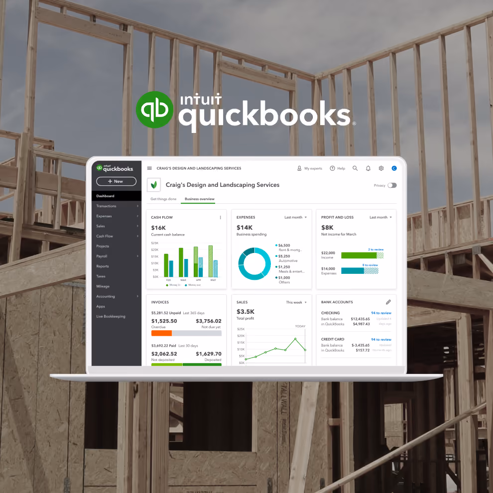 QuickBooks Online dashboard on a laptop over a construction site