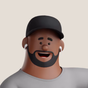 Cartoon avatar of a smiling man with a black beard, wearing a black cap, gray shirt, and white wireless earbuds.