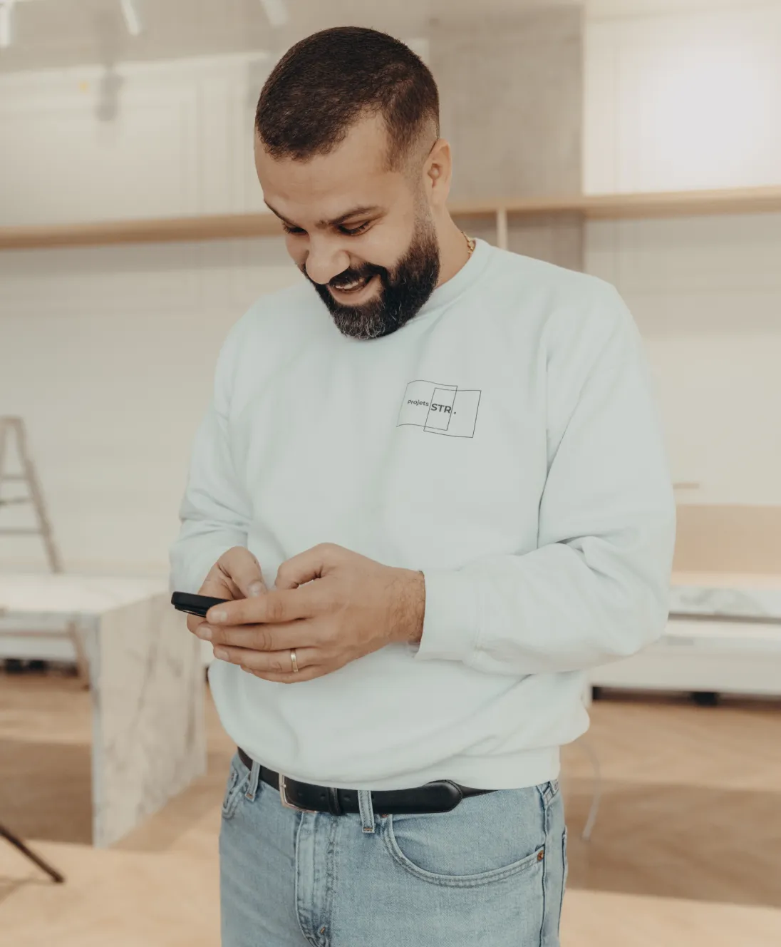 Rami looking at his phone