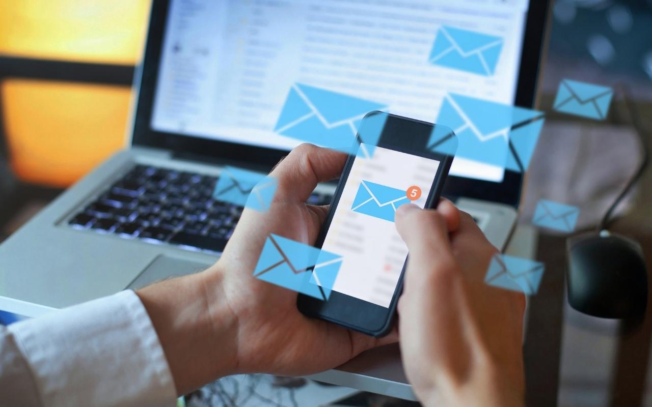a person checking emails on his phone