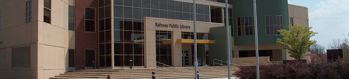 Facade of Rahway Public Library with entrance steps and trees under a partly cloudy sky.