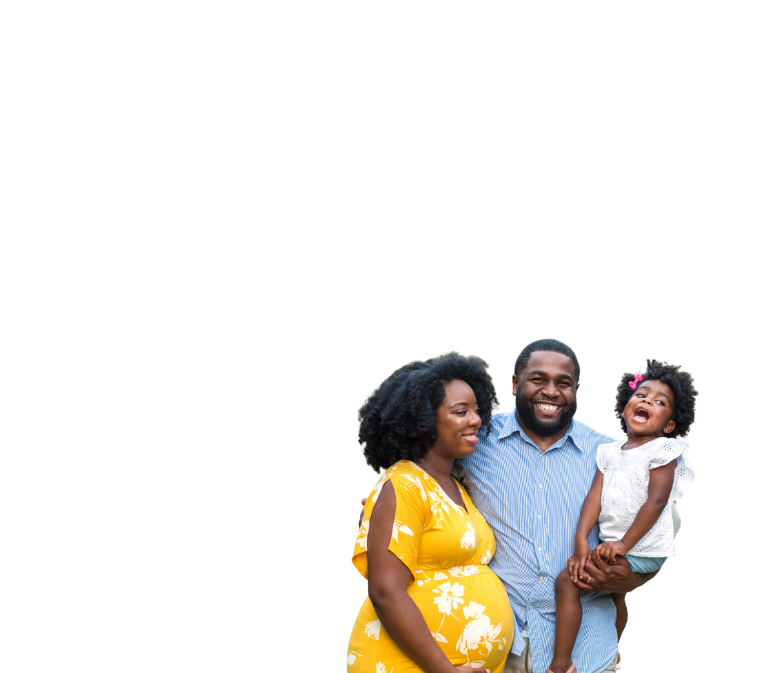 A smiling Black family, including a pregnant mother in a yellow floral dress, a father, and a young daughter, posing happily together.