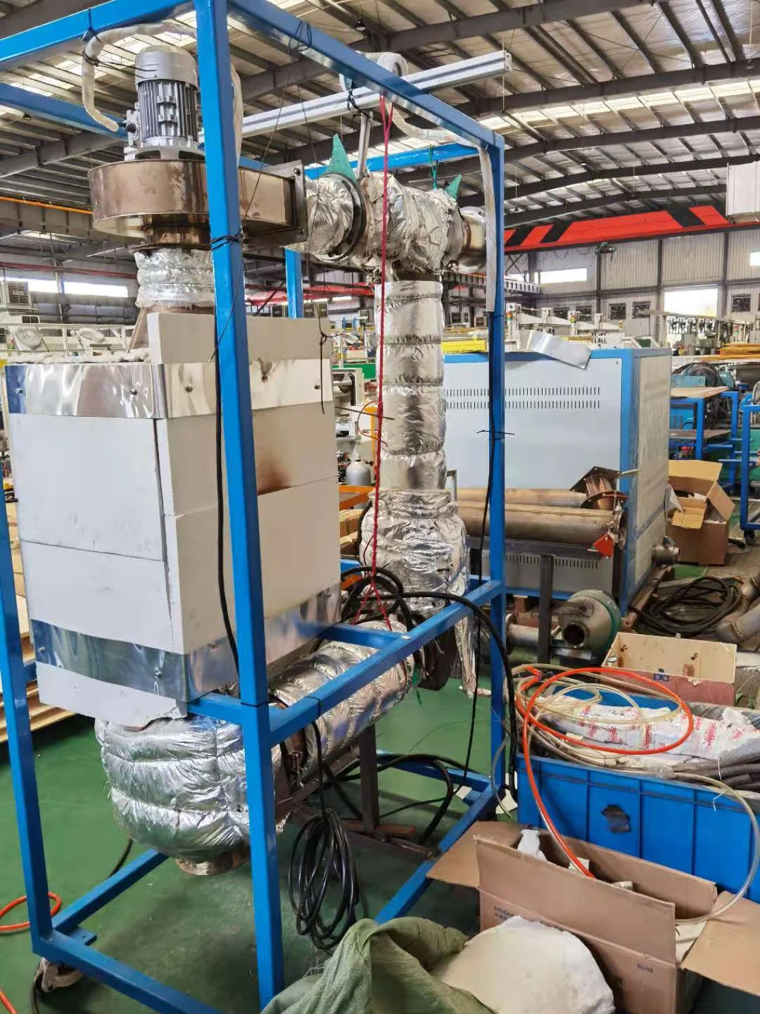 Original thermal circulation regeneration system with exposed blue frame, insulated piping and mechanical components