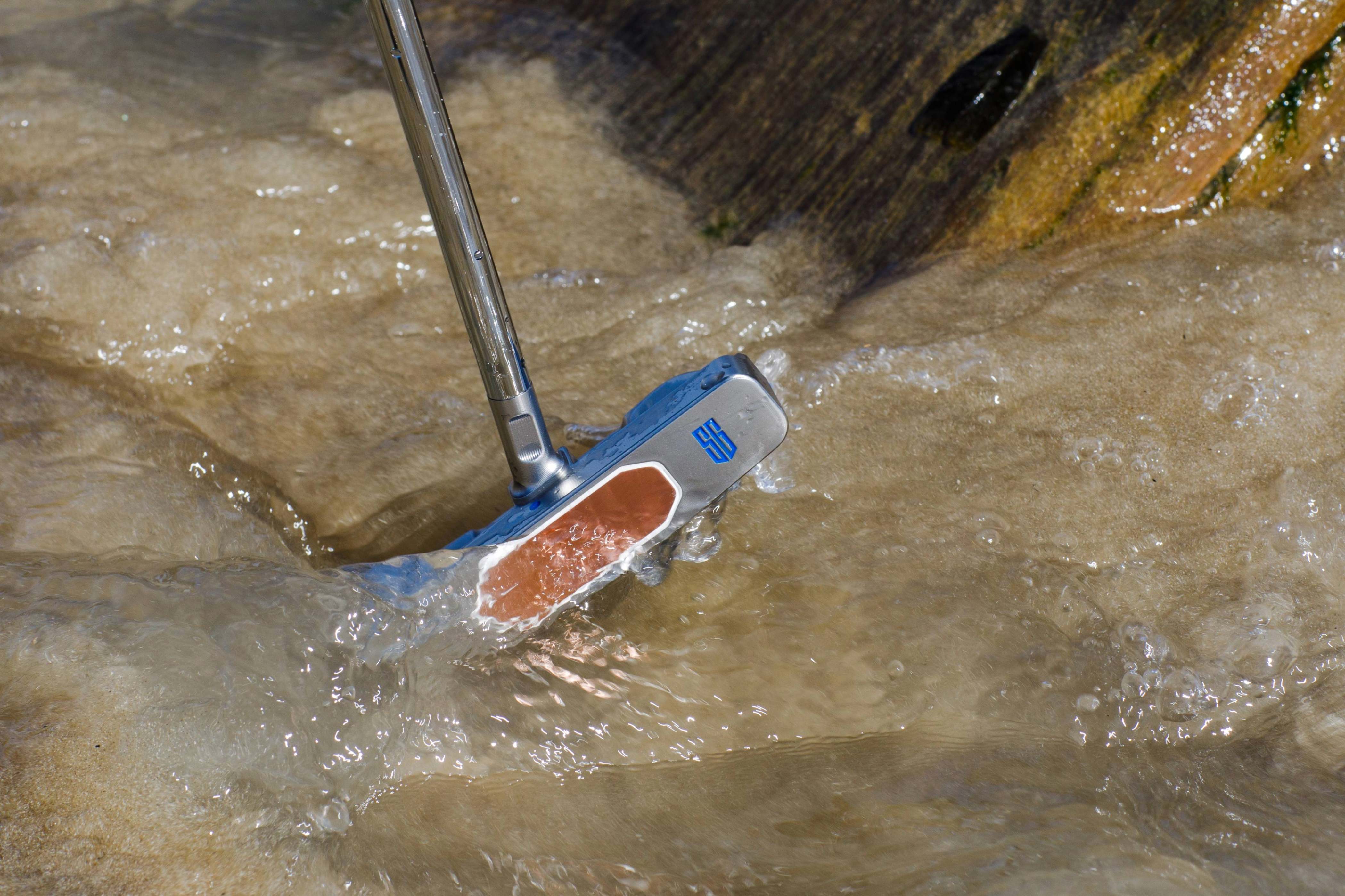 Anchor Line putter by SINK Golf shot on coastal rock