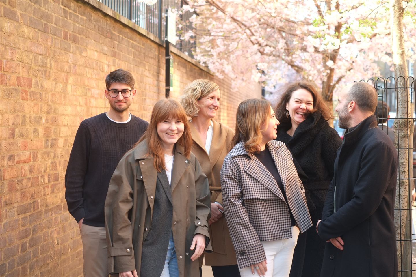 The Scenario Architecture team walking beneath blossom