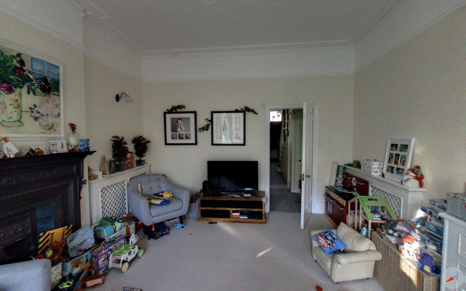 The reception room before the work, with a boxed-in fireplace and a narrow doorway