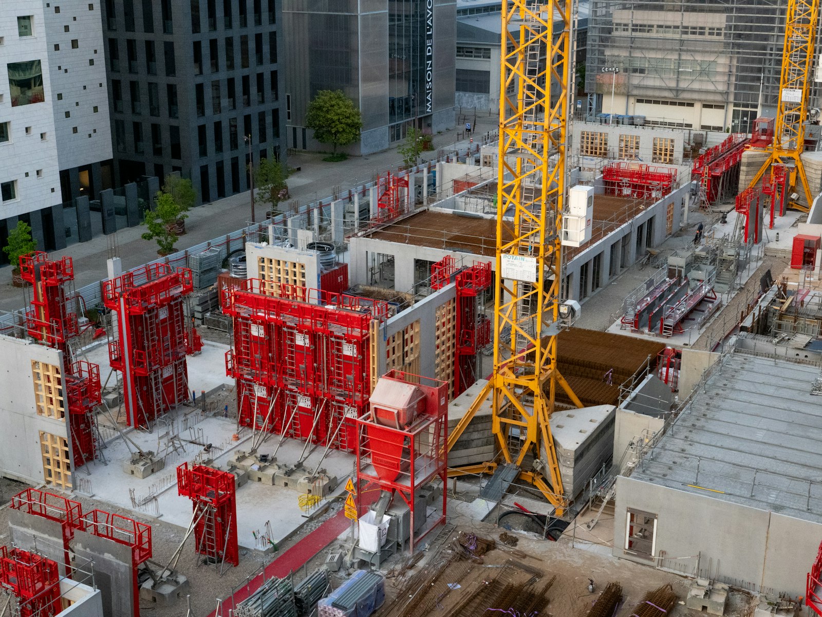 Construction site with tower crane and equipment | Westside Construction Group