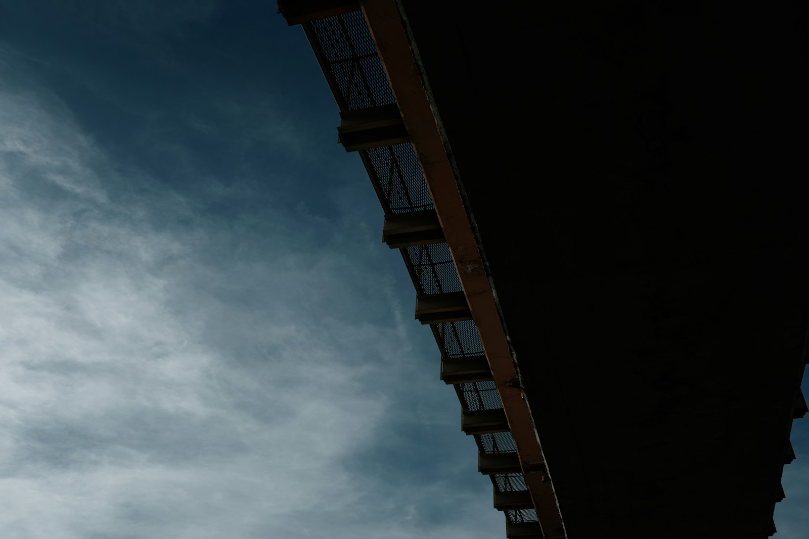 Looking up at a concrete building facade | Westside Construction Group