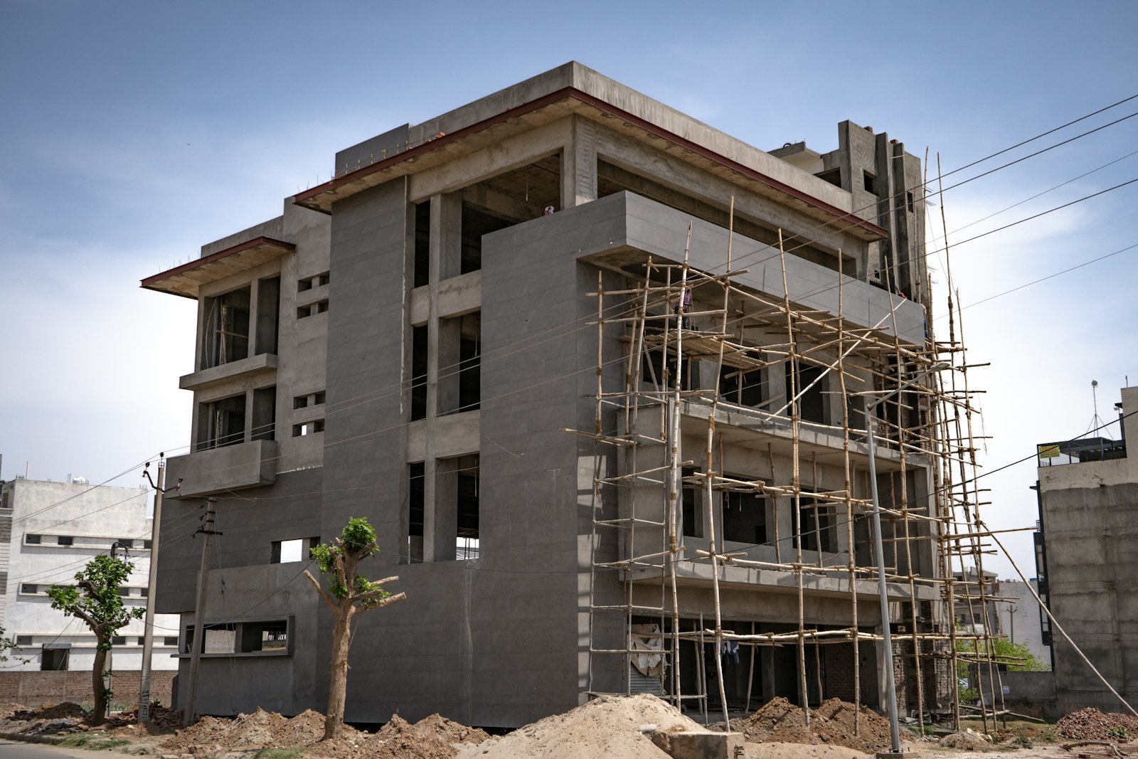 Multi-story residential building under construction with scaffolding | Westside Construction Group