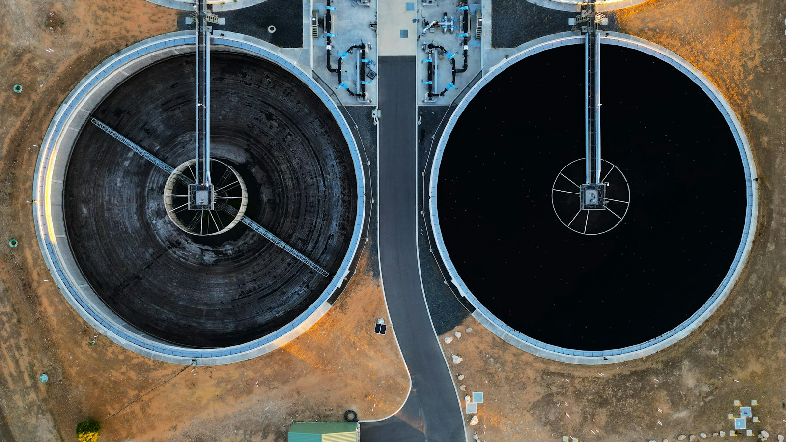 Aerial view of large storage tanks at a water facility | Westside Construction Group