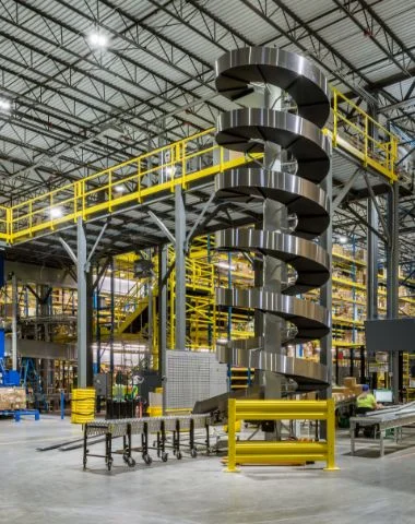Worker in hard hat and safety gear inside a facility | Westside Construction Group