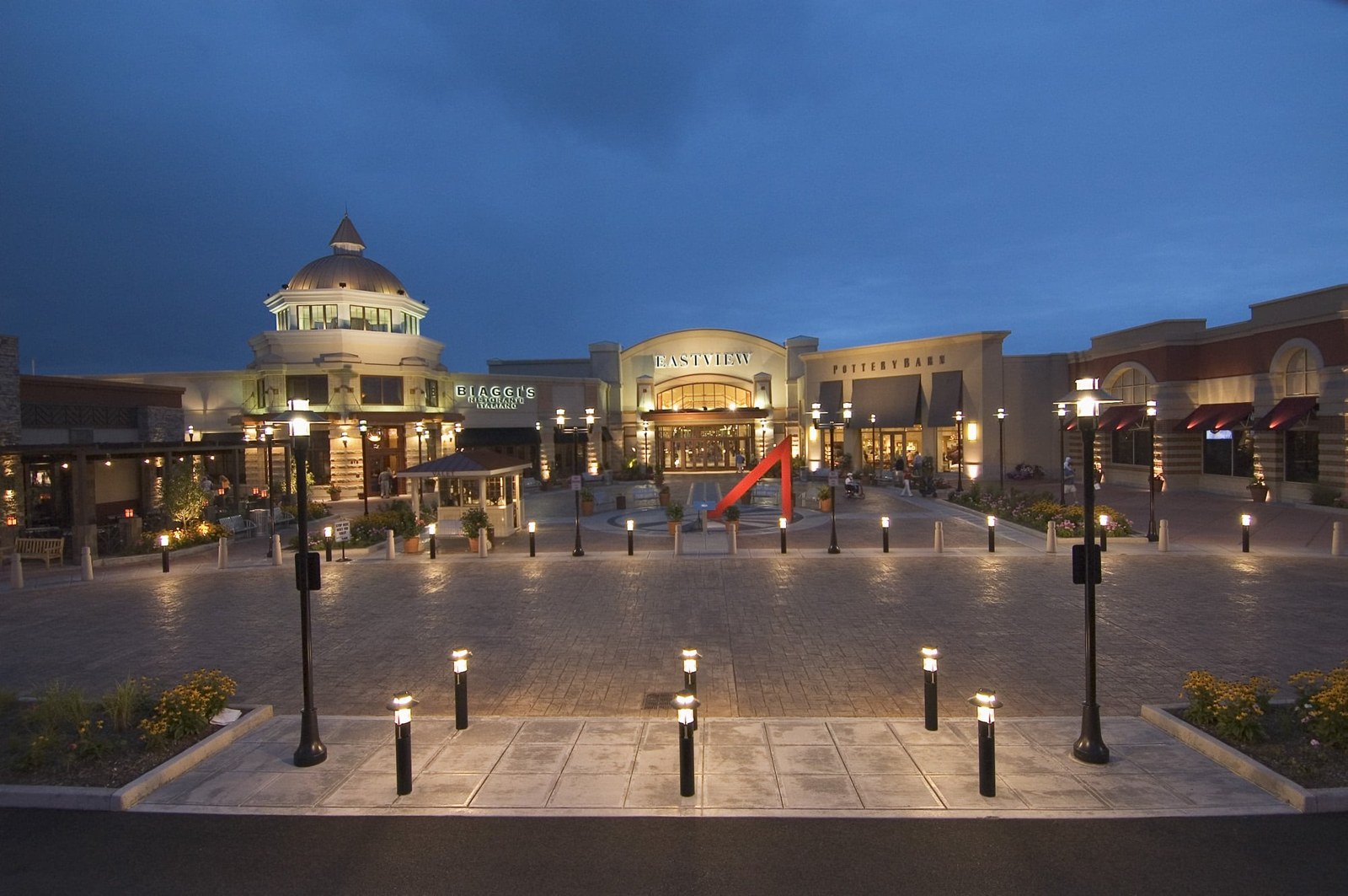 Eastview Mall entrance plaza in Victor, New York, at dusk