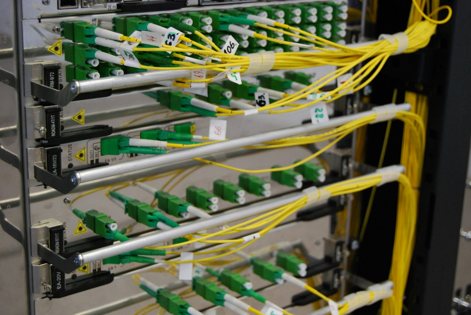Yellow and green electrical cabling in a rack, illustrating data center electrical work | Westside Construction Group