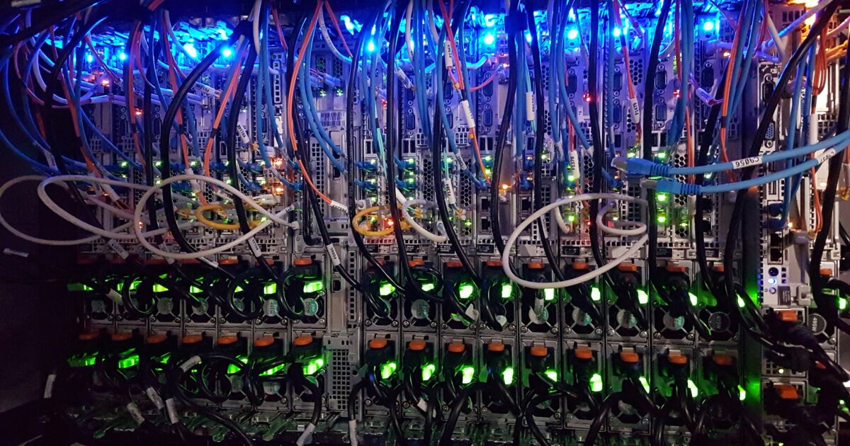 Rows of server racks inside a data center | Westside Construction Group