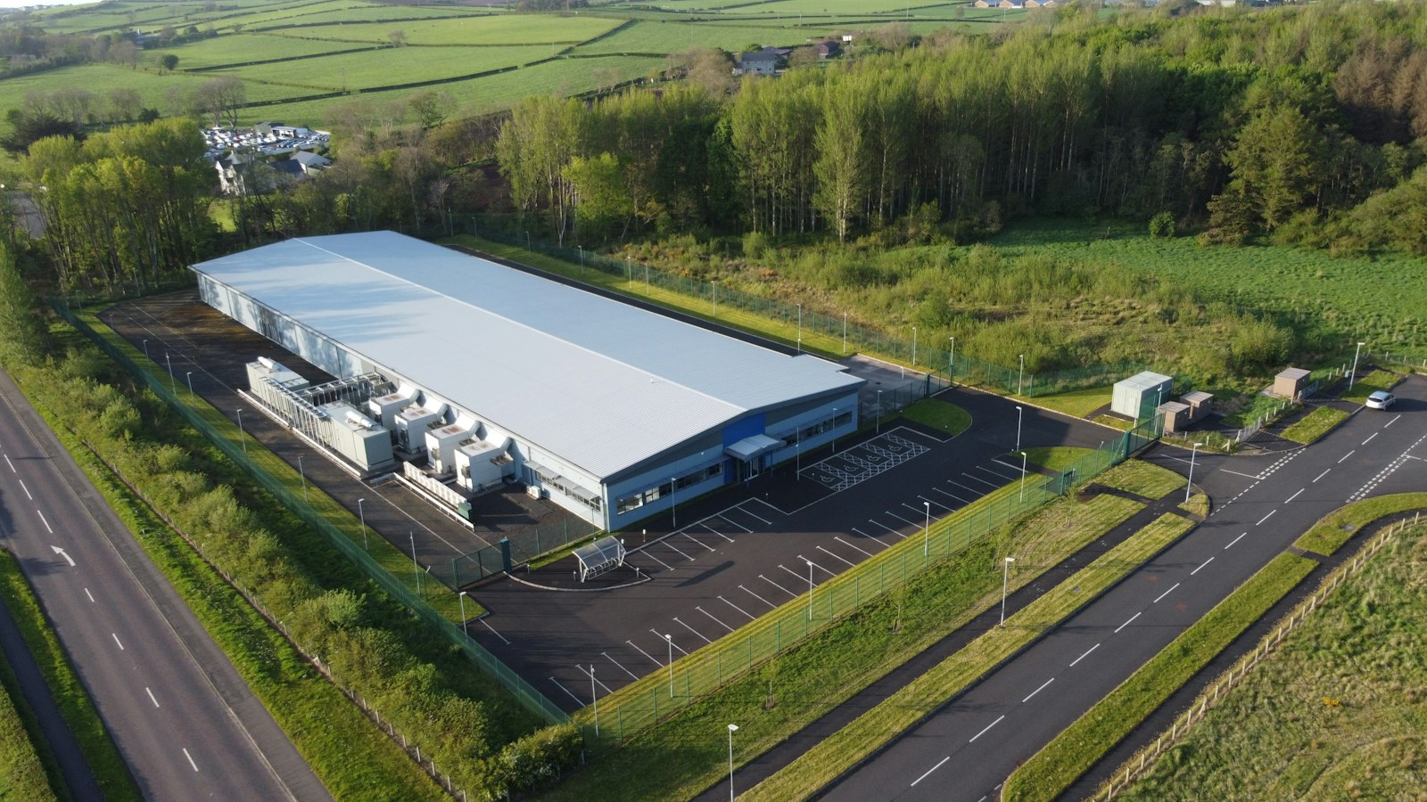 Aerial view of a large industrial building and surrounding site | Westside Construction Group